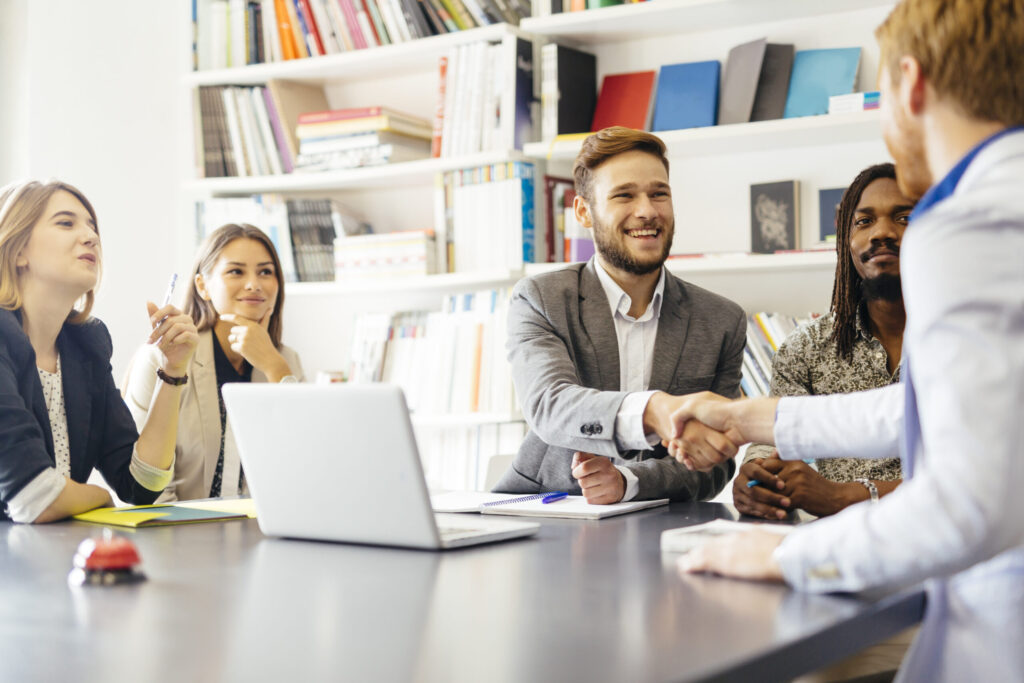 Business shaking hand with a client