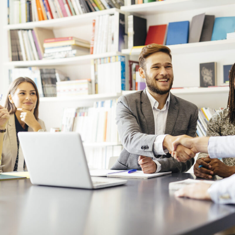 Business shaking hand with a client